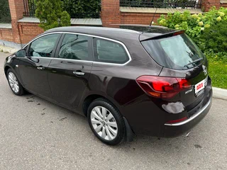 2014 Opel Astra J Рестайлинг, коричневый, 735000 рублей, вид 5