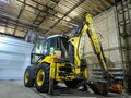 2005 New Holland LB115, золотистый, 5150000 рублей - вид 2