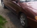 2001 Kia Spectra I Рестайлинг 1, пурпурный, 300000 рублей - вид 2