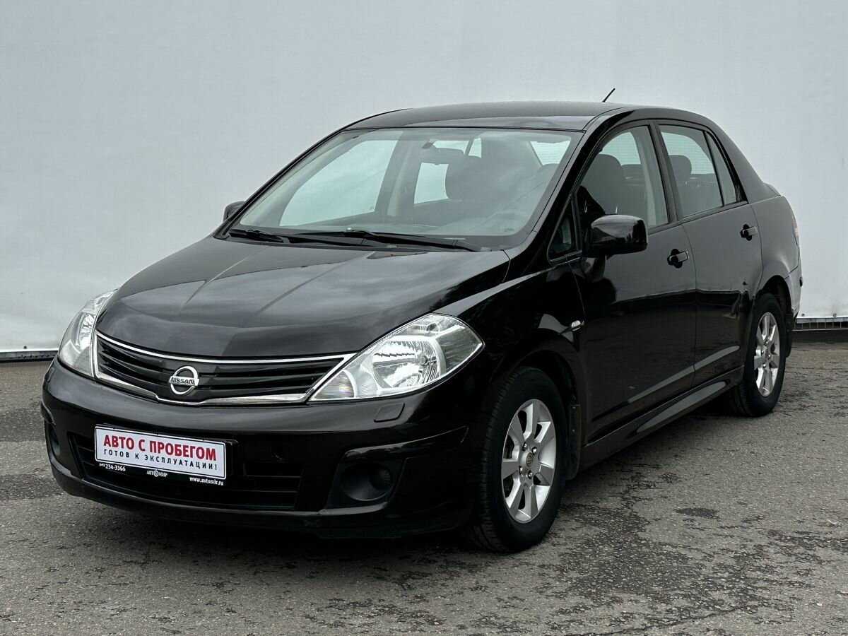 Открыть фотографии: Nissan Tiida I