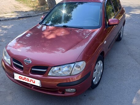 2000 Nissan Almera II (N16), пурпурный, вид 1