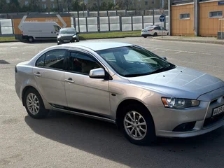 2011 Mitsubishi Lancer X Рестайлинг, серебристый, 555000 рублей, вид 3
