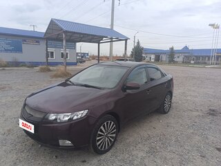 2011 Kia Cerato 6-speed II, пурпурный, 650000 рублей, вид 1