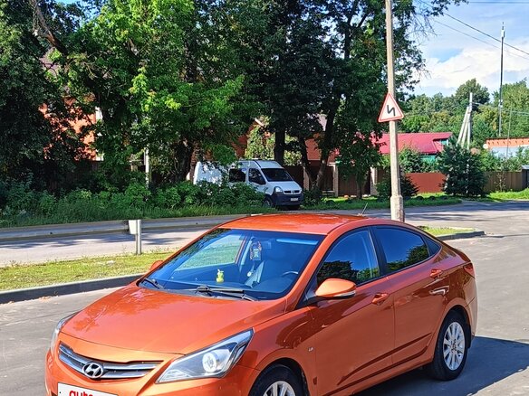 2014 Hyundai Solaris I Рестайлинг, оранжевый - вид 17