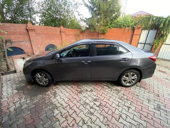 2014 Toyota Corolla XI (E160, E170, E180), серый, 1050000 рублей - вид 1