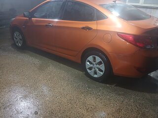 2015 Hyundai Solaris I Рестайлинг, оранжевый, 650000 рублей, вид 4
