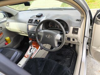 2008 Toyota Corolla Axio X (E140, E150), серый, 650000 рублей, вид 5