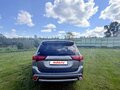 2016 Mitsubishi Outlander PHEV III Рестайлинг 2, серый, 2500000 рублей - вид 4
