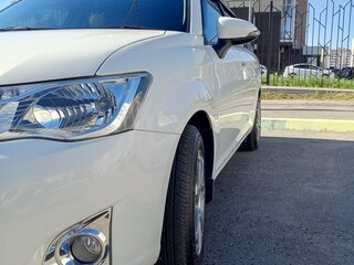2012 Toyota Corolla Fielder XI (E160, E170, E180), белый, 1050000 рублей, вид 2