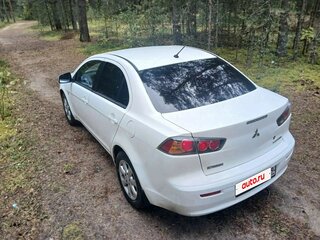 2011 Mitsubishi Lancer X Рестайлинг, белый, 640000 рублей, вид 4