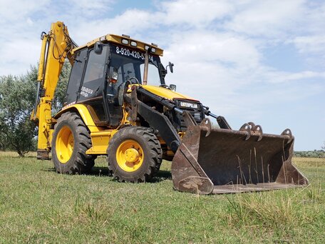 1997 Caterpillar 428, жёлтый, 3200000 рублей, вид 1