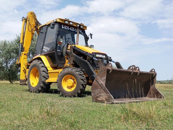 1997 Caterpillar 428, жёлтый, 3200000 рублей