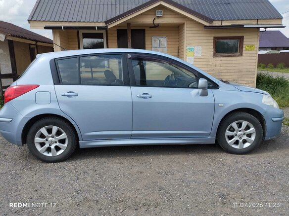 2010 Nissan Tiida I Рестайлинг, голубой, 595000 рублей - вид 1