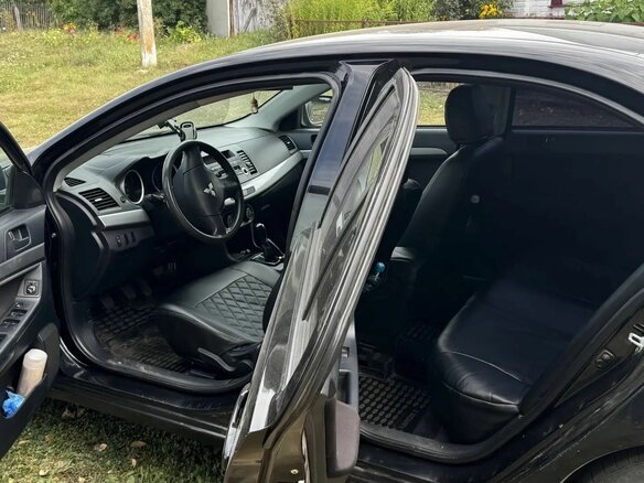 2010 Mitsubishi Lancer X, чёрный, 550000 рублей - вид 4