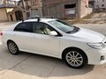 2011 Toyota Corolla X (E140, E150) Рестайлинг, белый, 970000 рублей - вид 1
