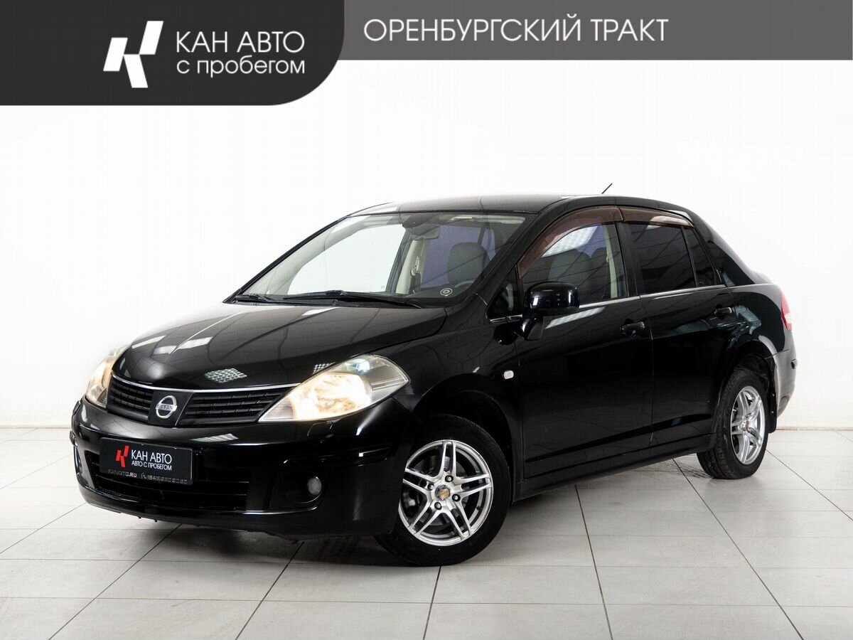Открыть фотографии: Nissan Tiida I