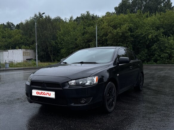2010 Mitsubishi Lancer X, чёрный, 685000 рублей - вид 1