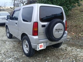 2011 Suzuki Jimny Kei car III Рестайлинг 1, серебристый, 1050000 рублей, вид 5