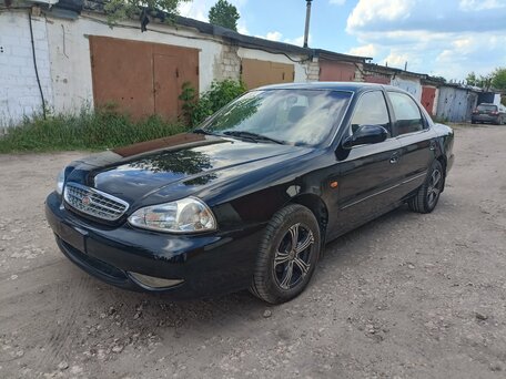 2001 Kia Clarus II, чёрный, 230000 рублей, вид 1