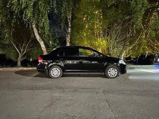 2010 Nissan Tiida I Рестайлинг, чёрный, 900000 рублей, вид 2