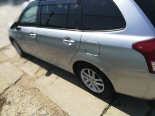 2012 Toyota Corolla Fielder XI (E160, E170, E180), серый, 850000 рублей, вид 3