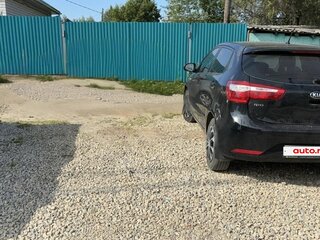 2014 Kia Rio 5-speed III, чёрный, 850000 рублей, вид 2