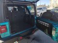 2024 Jeep Wrangler 4xe IV (JL) Рестайлинг, голубой, 6650000 рублей - вид 5