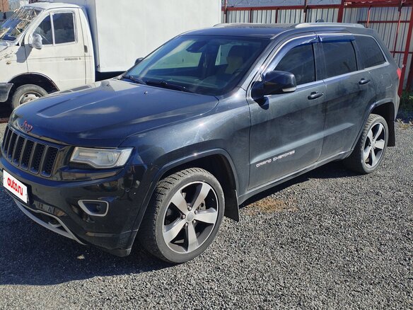 2014 Jeep Grand Cherokee IV (WK2) Рестайлинг, чёрный, 2500000 рублей - вид 1
