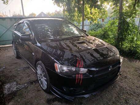 2010 Mitsubishi Lancer X, чёрный, 860000 рублей, вид 1