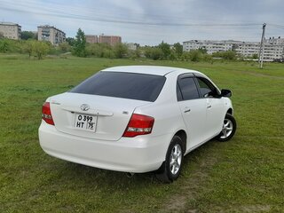 2011 Toyota Corolla Axio X (E140, E150) Рестайлинг, белый, 900000 рублей, вид 3