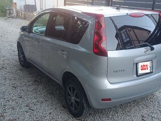 2011 Nissan Note I Рестайлинг, серебристый, 680000 рублей, вид 5
