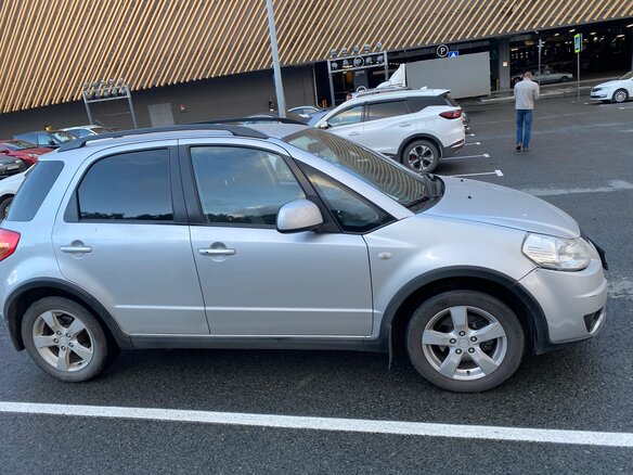 2011 Suzuki SX4 I (Classic) Рестайлинг, серебристый - вид 1