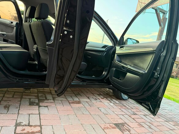 2012 Mitsubishi Lancer X Рестайлинг, чёрный, 669000 рублей - вид 12