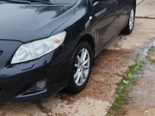 2010 Toyota Corolla X (E140, E150), чёрный, 595000 рублей, вид 4