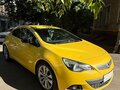 2014 Opel Astra GTC J Рестайлинг, жёлтый - вид 2