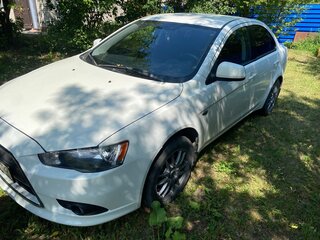 2012 Mitsubishi Lancer X Рестайлинг, белый, 860000 рублей, вид 1