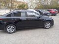 2021 Kia Rio IV Рестайлинг, чёрный, 1400000 рублей - вид 1