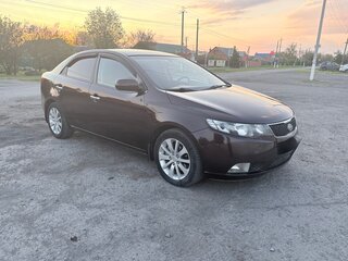 2011 Kia Cerato 6-speed II, пурпурный, 980000 рублей, вид 2