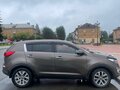 2015 Kia Sportage III Рестайлинг, коричневый, 1600000 рублей - вид 1
