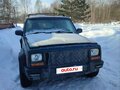 1998 Jeep Cherokee II (XJ) Рестайлинг, зелёный - вид 1