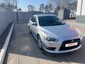 2011 Mitsubishi Lancer X Рестайлинг, серебристый, 830000 рублей - вид 2