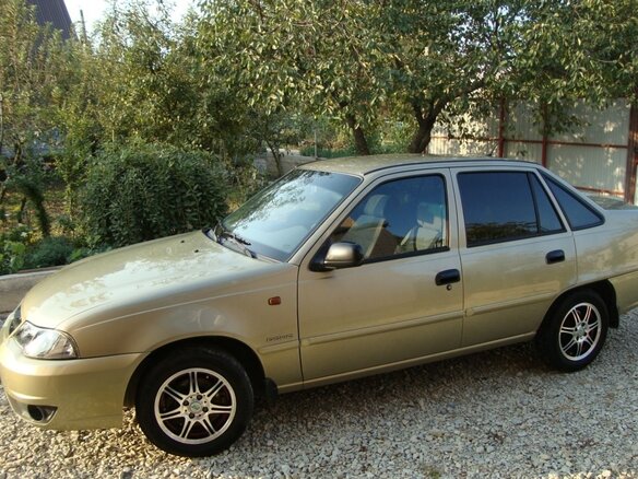 2011 Daewoo Nexia I Рестайлинг, бежевый - вид 1
