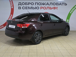 2010 Kia Cerato 5-speed II, красный, 565000 рублей, вид 4
