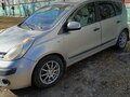 2007 Nissan Note I, серебристый, 550000 рублей - вид 1