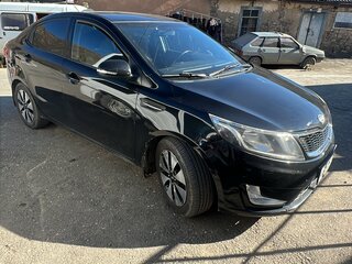 2012 Kia Rio 4-speed III, чёрный, 650000 рублей, вид 1