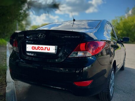 2011 Hyundai Solaris I, чёрный, 630000 рублей, вид 3