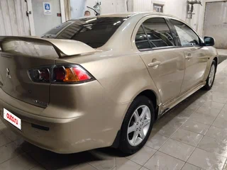 2010 Mitsubishi Lancer X, коричневый, 545000 рублей, вид 2