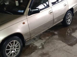 2010 Daewoo Nexia I Рестайлинг, жёлтый, 137000 рублей, вид 2