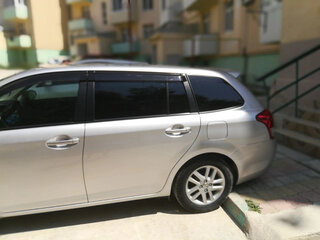 2012 Toyota Corolla Fielder XI (E160, E170, E180), серый, 850000 рублей, вид 4