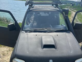 2009 Suzuki Jimny Kei car III Рестайлинг 1, чёрный, 650000 рублей, вид 2